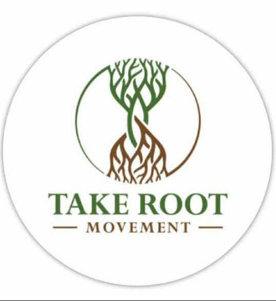 Round fridge magnet featuring the Take Root Movement logo with intertwined green tree and brown roots on a white background.