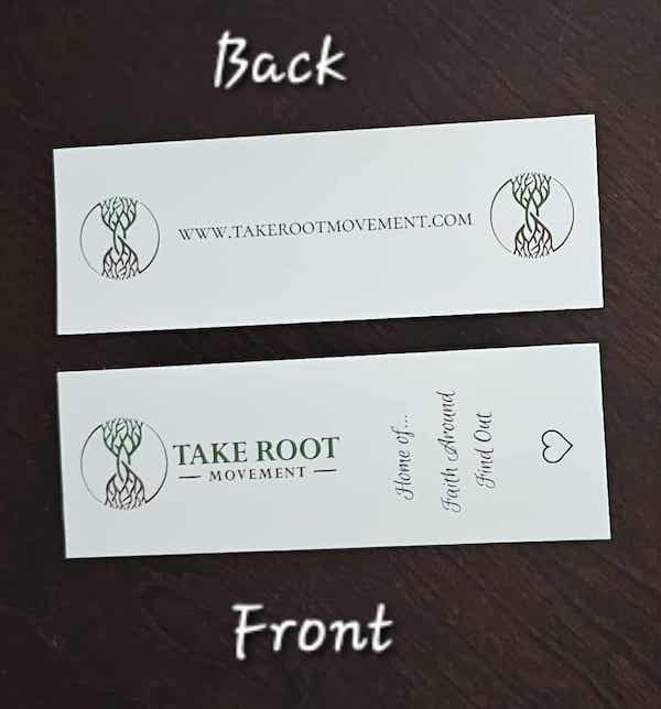 Front and back view of Take Root Movement Christian bookmarks on a dark wood surface, showing the tree and roots logo, website URL, and the ‘Home of Faith Around Find Out’ message.