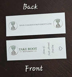 Front and back view of Take Root Movement Christian bookmarks on a dark wood surface, showing the tree and roots logo, website URL, and the ‘Home of Faith Around Find Out’ message.