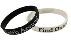 Black and white Christian silicone wristbands displaying the ‘Faith Around Find Out’ message and tree and roots logo, shown on a white surface.
